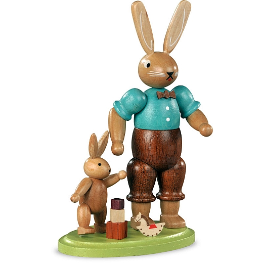 Easter bunny father with playing child, small colored-stained