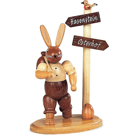 Easter bunny hiker at signpost, small natural