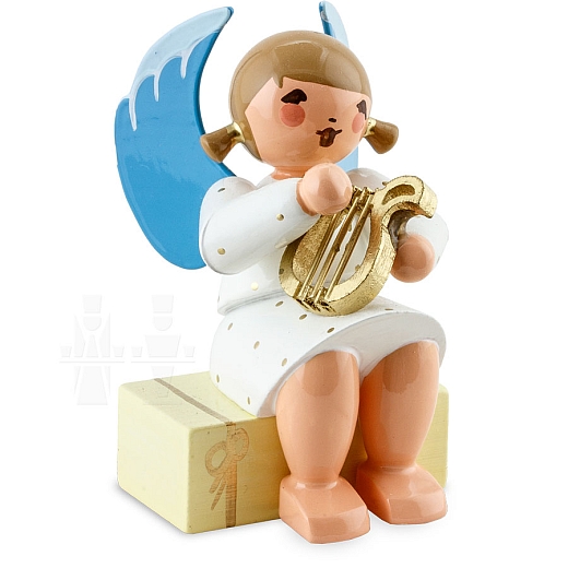 Angel sitting on gift package with Lyre white