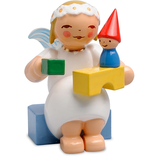 Marguerite angel sitting with Building Blocks