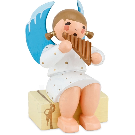 Angel sitting on gift package with Pan Flute white
