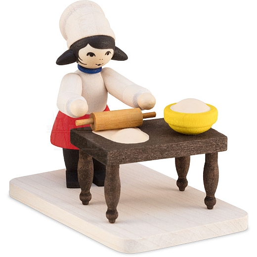 Winter child cookie baker girl with table stained from Ulmik