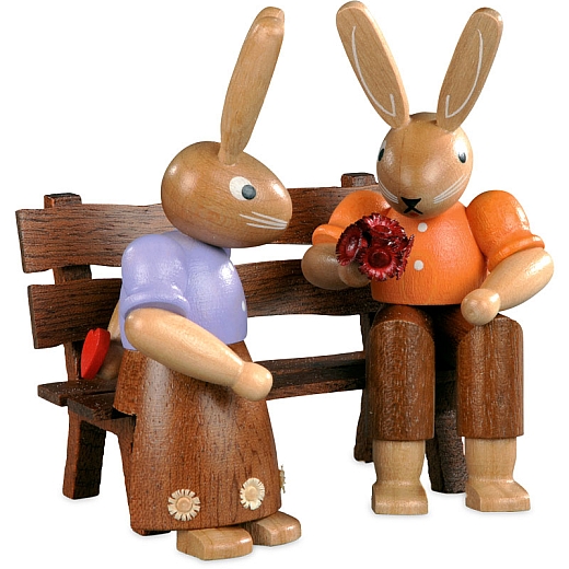 Easter bunny couple on garden bench small colored stained