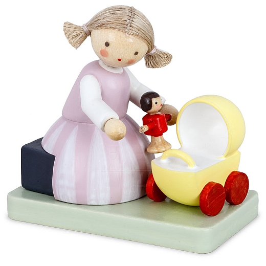Girl with doll and dolls pram